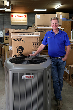 Employee Posing With Air Conditioner